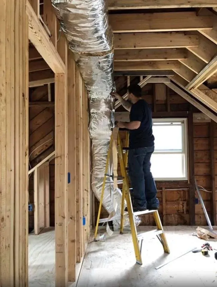 Benefits of Regular AC Maintenance & Tune-Ups Family enjoying a comfortable living room with improved indoor air quality